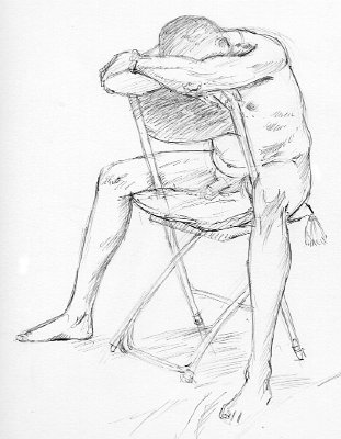 m  nude sitting on chair